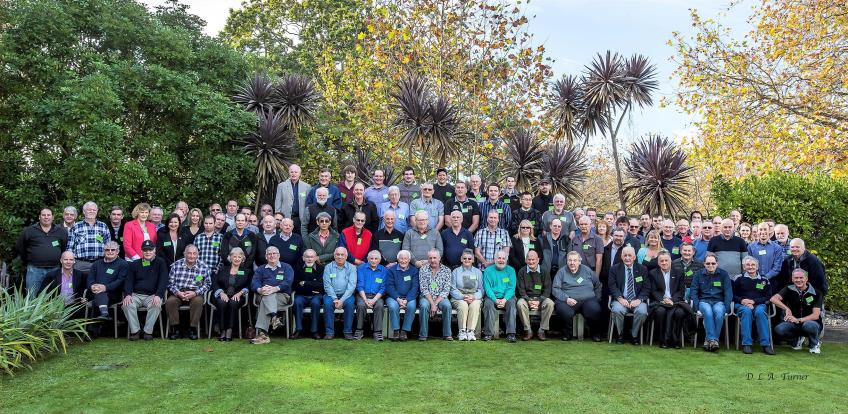 Conference delegates and attendees pause for group photo