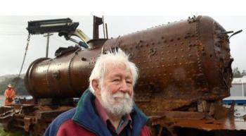 Project Steam chairman John Sutherland with the P class steam locomotive P133 at the KiwiRail yard in Mosgiel. Photo: Stephen Jaquiery